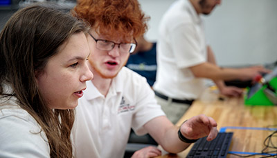 Two students talking to each other.
