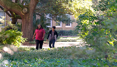 Two students walking on the Historic Horseshoe. 