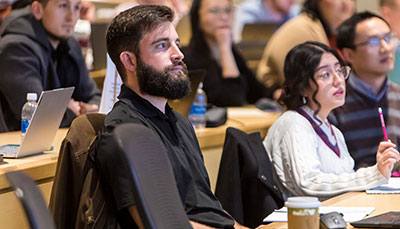 Students focused on the teacher in a class.