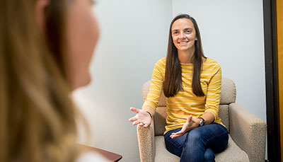 Person in a counseling session talking to someone.